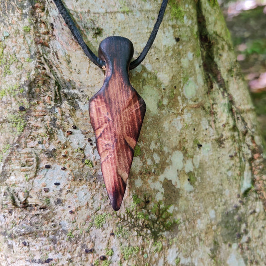 Hand carved spear pendant